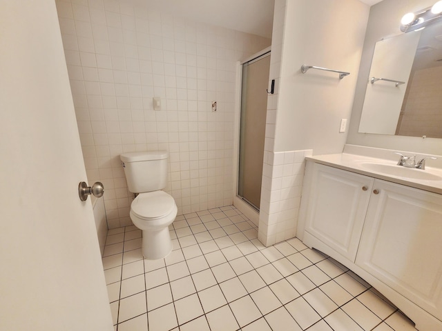 403 Littleford Ln, Faribault, MN 55021 - bathroom with tile patterned flooring, tile walls, toilet, a stall shower, and vanity