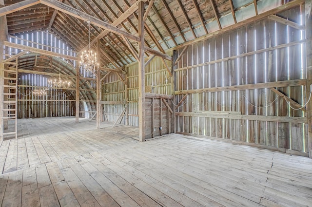 8632 Neal Ave S, Denmark Twp, MN 55033 - misc room with hardwood / wood-style floors, lofted ceiling, and a chandelier