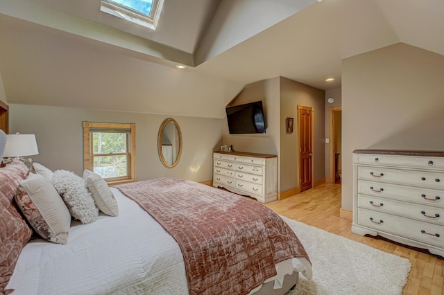 8632 Neal Ave S, Denmark Twp, MN 55033 - bedroom with vaulted ceiling, light wood-style flooring, a skylight, and recessed lighting