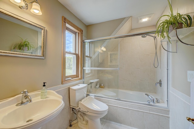 8632 Neal Ave S, Denmark Twp, MN 55033 - bathroom featuring a sink, tiled shower / bath combo, and toilet