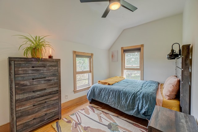 8632 Neal Ave S, Denmark Twp, MN 55033 - bedroom with lofted ceiling, light wood finished floors, and ceiling fan