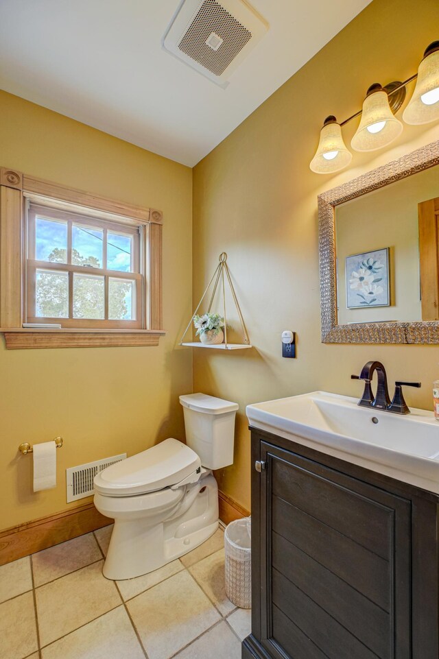 8632 Neal Ave S, Denmark Twp, MN 55033 - half bath with toilet, baseboards, vanity, and tile patterned floors