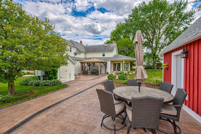 8632 Neal Ave S, Denmark Twp, MN 55033 - view of patio / terrace featuring a gazebo, outdoor dining area, and an outdoor structure
