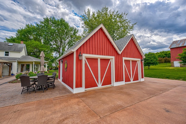 8632 Neal Ave S, Denmark Twp, MN 55033 - view of outbuilding with outdoor dining area