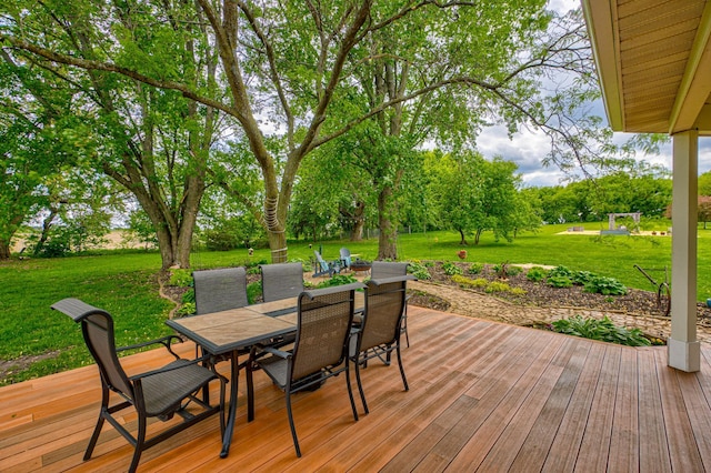 8632 Neal Ave S, Denmark Twp, MN 55033 - wooden deck with outdoor dining area and a lawn