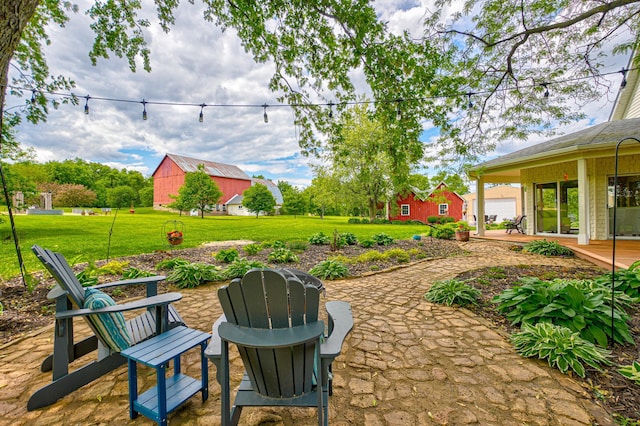 8632 Neal Ave S, Denmark Twp, MN 55033 - view of green lawn with a patio area and an outbuilding