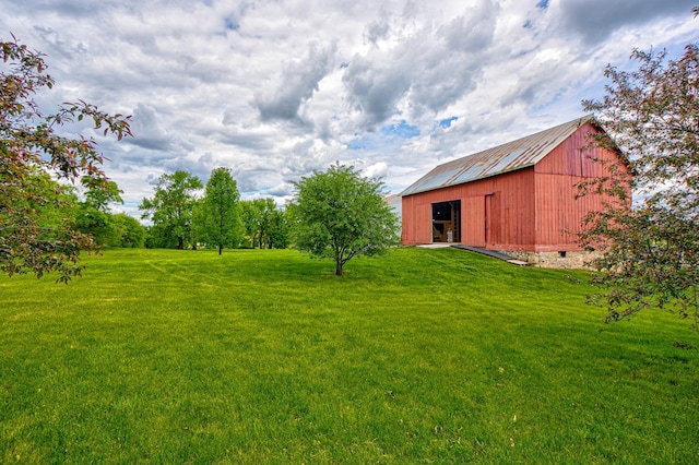 8632 Neal Ave S, Denmark Twp, MN 55033 - view of green lawn featuring an outdoor structure