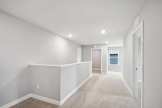 8397 Brumby Trl, Woodbury, MN 55129 - hall featuring carpet flooring, baseboards, recessed lighting, and an upstairs landing