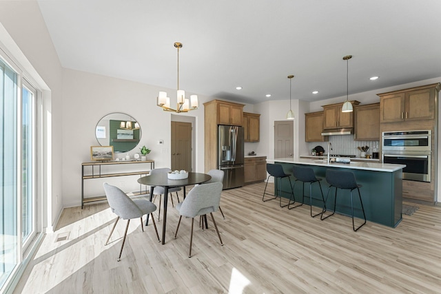 13430 Cadogan Way, Rosemount, MN 55068 - dining space featuring light wood-type flooring, a chandelier, and recessed lighting