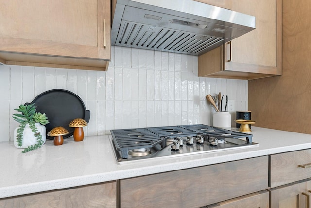13430 Cadogan Way, Rosemount, MN 55068 - kitchen featuring range hood, light countertops, backsplash, and stainless steel gas cooktop