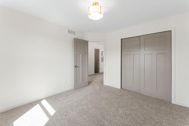 13430 Cadogan Way, Rosemount, MN 55068 - unfurnished bedroom featuring light colored carpet, baseboards, and a closet