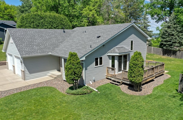 8790 212th St N, Forest Lake, MN 55025 - back of property with a shingled roof, a deck, a garage, and driveway