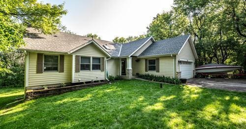 2211 Douglynn Ln, Saint Paul, MN 55119 - single story home featuring a garage, asphalt driveway, and a front yard