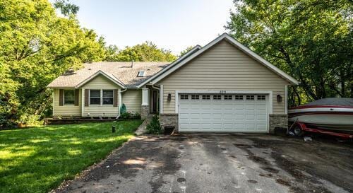 2211 Douglynn Ln, Saint Paul, MN 55119 - ranch-style home featuring driveway, a garage, and a front lawn
