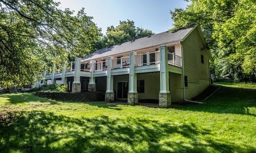 2211 Douglynn Ln, Saint Paul, MN 55119 - back of house featuring a lawn