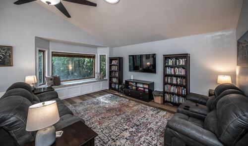 2211 Douglynn Ln, Saint Paul, MN 55119 - living area with lofted ceiling, a ceiling fan, and wood finished floors
