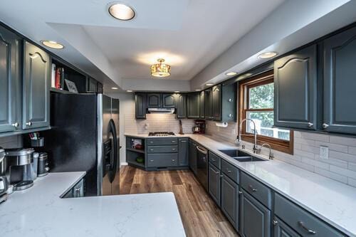 2211 Douglynn Ln, Saint Paul, MN 55119 - kitchen with a sink, stainless steel dishwasher, dark wood-type flooring, fridge with ice dispenser, and decorative backsplash