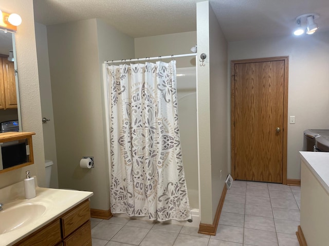 22 Jayvee Ln, Lake Sarah Twp, MN 56132 - full bathroom with washer and clothes dryer, vanity, tile patterned floors, and a shower with shower curtain