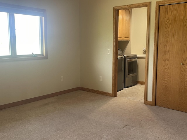 22 Jayvee Ln, Lake Sarah Twp, MN 56132 - empty room with washing machine and dryer and light carpet