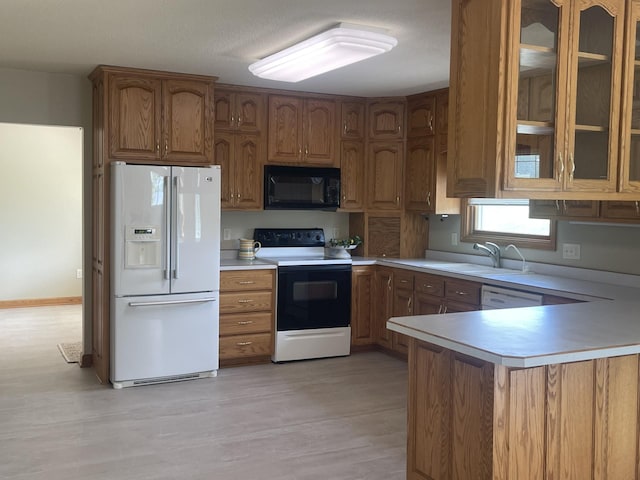 22 Jayvee Ln, Lake Sarah Twp, MN 56132 - kitchen with white appliances, brown cabinets, light countertops, and glass insert cabinets