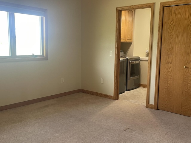 22 Jayvee Ln, Lake Sarah Twp, MN 56132 - spare room with washer and dryer and light colored carpet