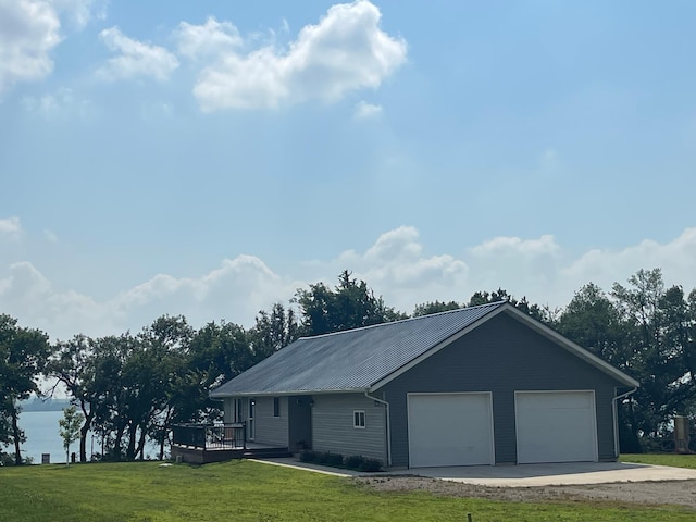 22 Jayvee Ln, Lake Sarah Twp, MN 56132 - view of front facade featuring a garage, a front yard, a deck, and a metal roof