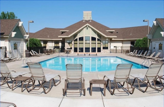 community pool with a patio area