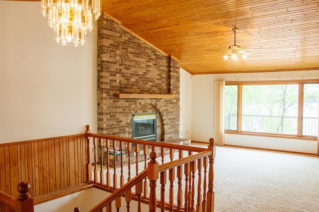 32682 S Bay Ln, Breezy Point, MN 56472 - staircase featuring wooden ceiling, vaulted ceiling, crown molding, carpet flooring, and a chandelier