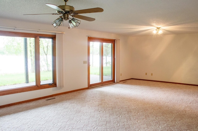 32682 S Bay Ln, Breezy Point, MN 56472 - carpeted spare room with healthy amount of natural light, baseboards, ceiling fan, and a textured ceiling