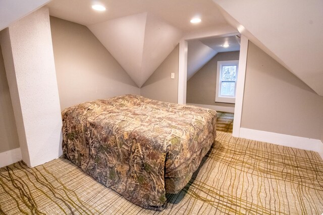 bedroom featuring recessed lighting, carpet floors, and vaulted ceiling