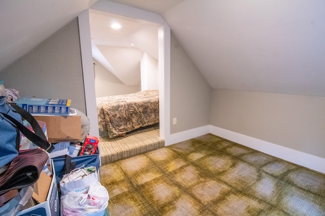 bonus room featuring lofted ceiling and carpet flooring