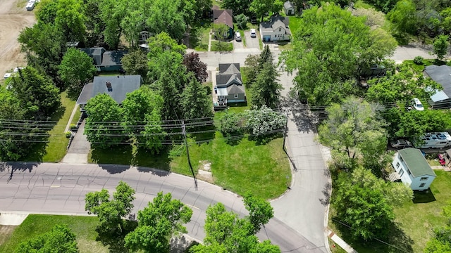 aerial perspective of suburban area with a tree filled landscape