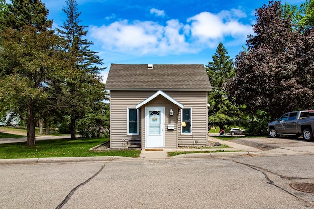 view of front of house with a shingled roof