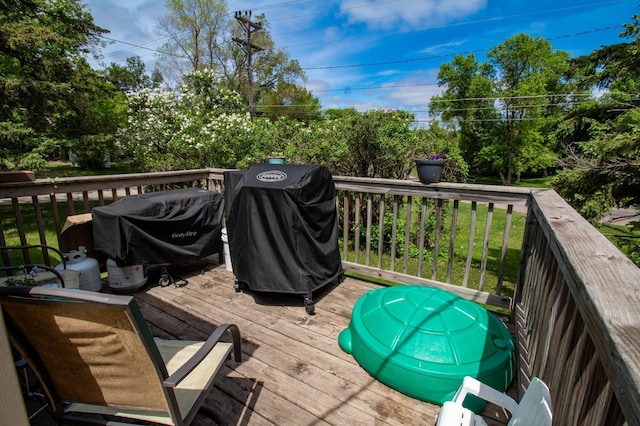 wooden deck featuring grilling area