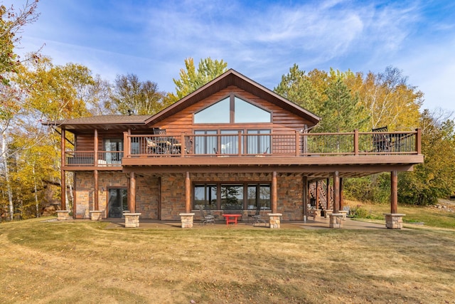 36737 Shoreview Dr, Wabana Twp, MN 55744 - back of house featuring a patio area, a yard, a wooden deck, and stone siding