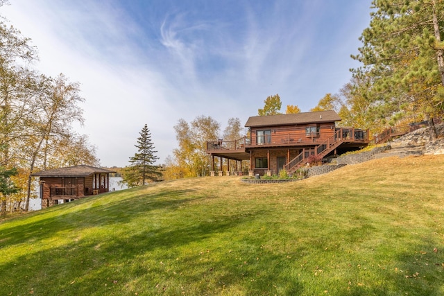36737 Shoreview Dr, Wabana Twp, MN 55744 - view of grassy yard featuring stairway and a wooden deck