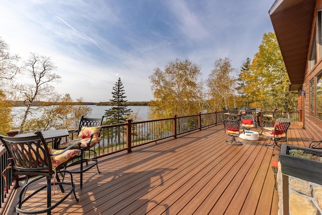 36737 Shoreview Dr, Wabana Twp, MN 55744 - wooden deck with outdoor dining area and a water view