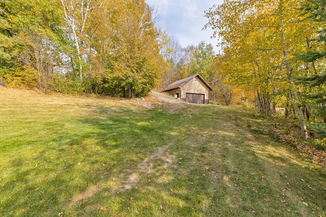 36737 Shoreview Dr, Wabana Twp, MN 55744 - view of green lawn with an outdoor structure and a detached garage