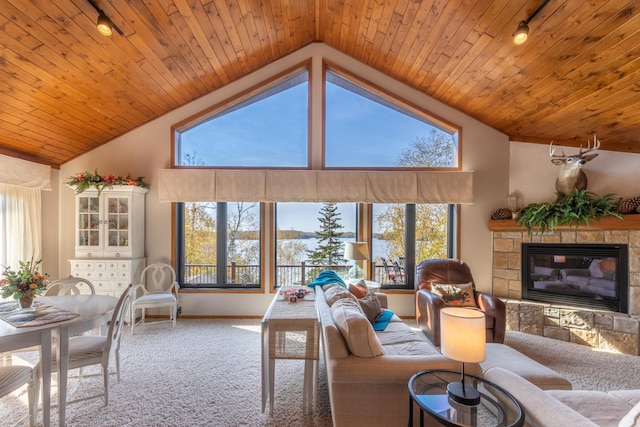 36737 Shoreview Dr, Wabana Twp, MN 55744 - living room featuring carpet flooring, plenty of natural light, a fireplace, vaulted ceiling, and wood ceiling