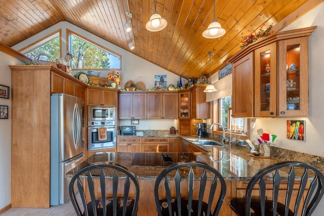 36737 Shoreview Dr, Wabana Twp, MN 55744 - kitchen with stainless steel appliances, a sink, lofted ceiling, wooden ceiling, and a peninsula