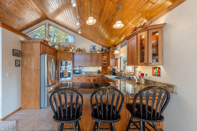 36737 Shoreview Dr, Wabana Twp, MN 55744 - kitchen with stainless steel appliances, vaulted ceiling, a sink, a peninsula, and wood ceiling