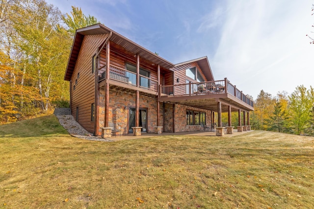 36737 Shoreview Dr, Wabana Twp, MN 55744 - back of house featuring a lawn, a patio area, and stone siding