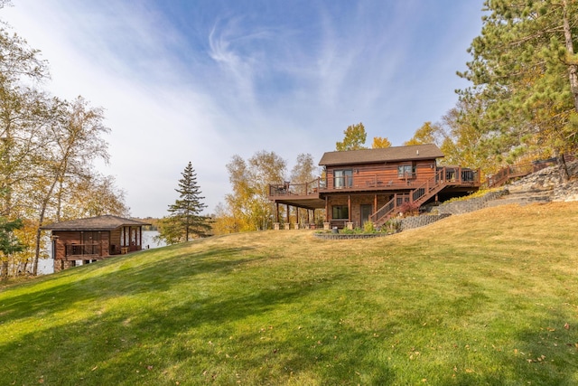 36737 Shoreview Dr, Wabana Twp, MN 55744 - view of grassy yard featuring stairway and a wooden deck