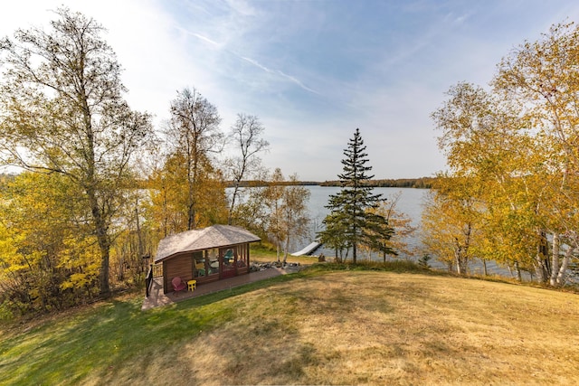 36737 Shoreview Dr, Wabana Twp, MN 55744 - view of grassy yard with a water view and an outbuilding