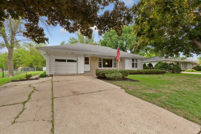 706 9th Ave SW, Faribault, MN 55021 - ranch-style house with a garage, driveway, and a front yard