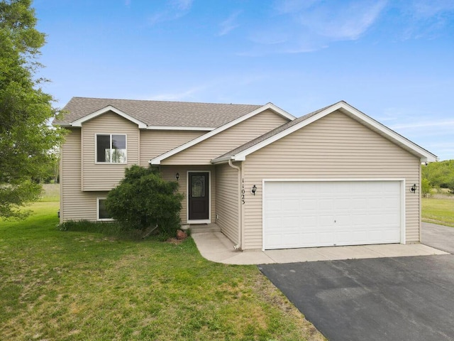 11023 171st Ave SE, Becker, MN 55308 - split level home featuring asphalt driveway, a front lawn, an attached garage, and a shingled roof