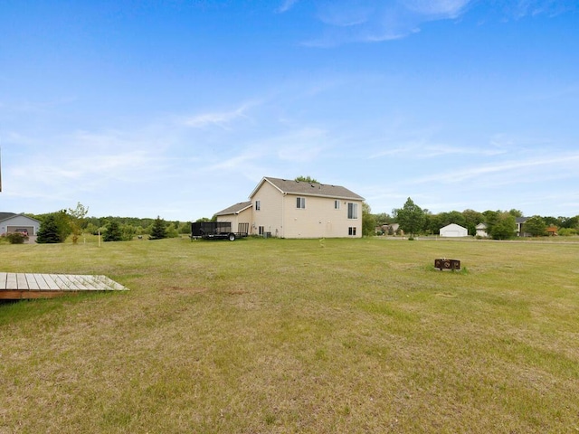 11023 171st Ave SE, Becker, MN 55308 - view of grassy yard with a wooden deck