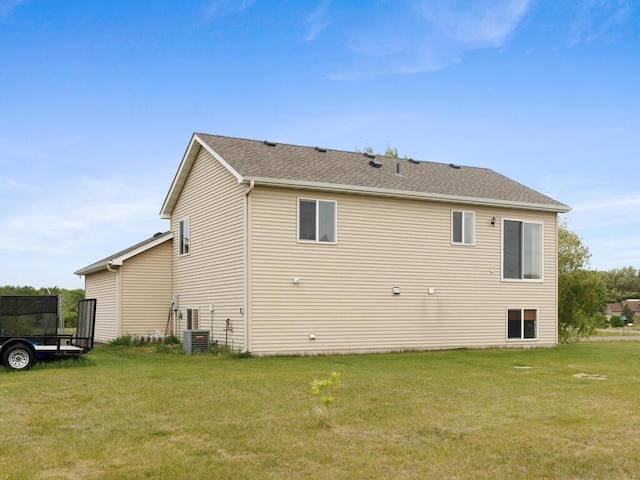 11023 171st Ave SE, Becker, MN 55308 - rear view of property featuring a lawn and central AC