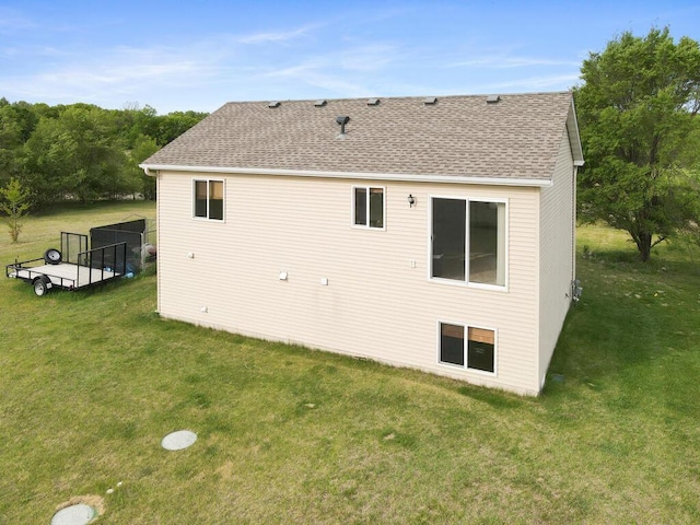 11023 171st Ave SE, Becker, MN 55308 - rear view of property featuring a lawn and a shingled roof