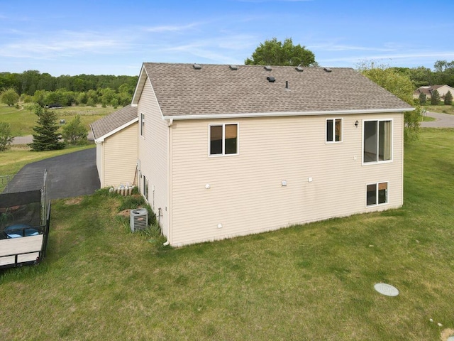 11023 171st Ave SE, Becker, MN 55308 - back of house with a yard and roof with shingles